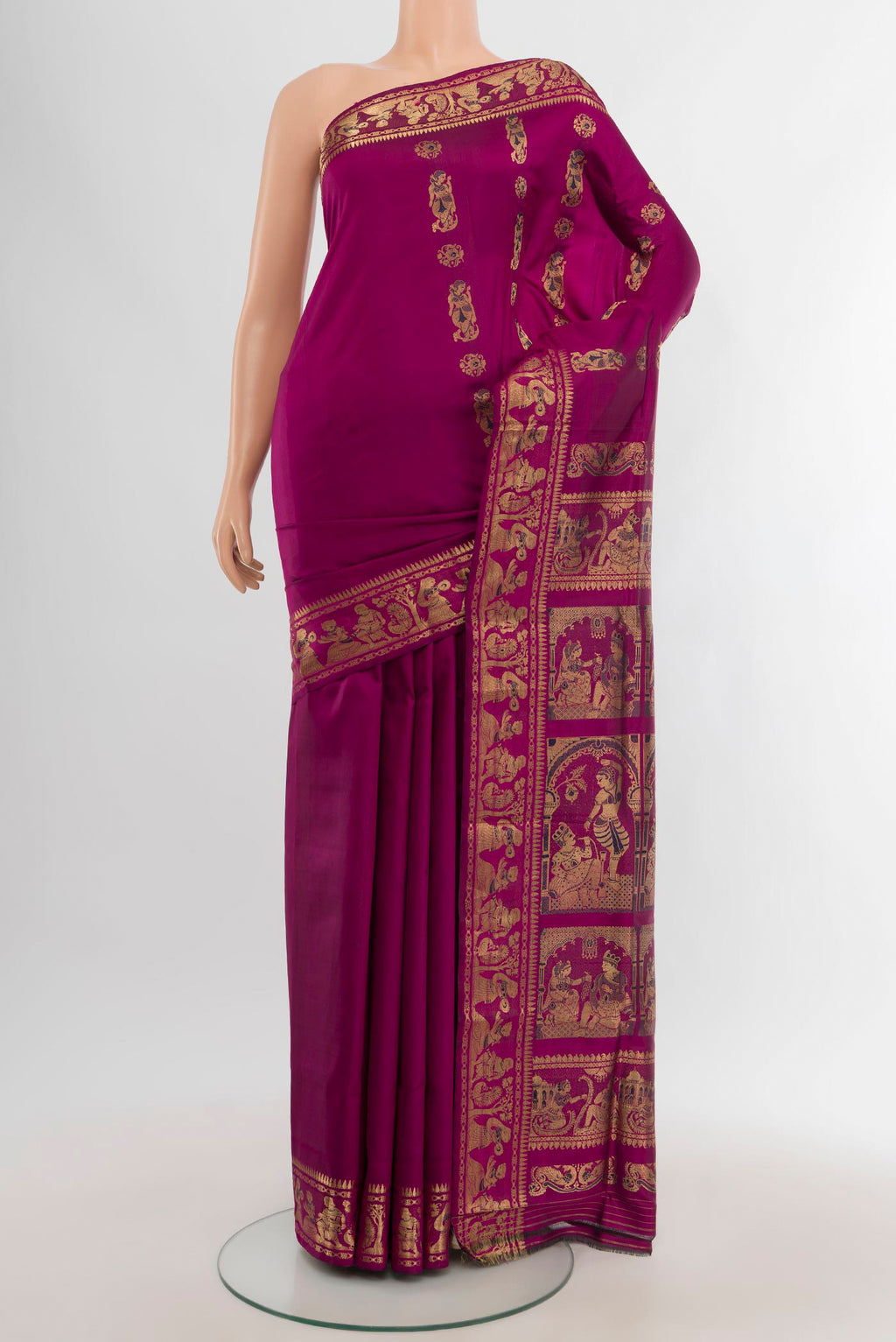 Magenta Baluchari Silk Saree with Zari And Thread Butta on the body and Zari Border.  displayed on a mannequin