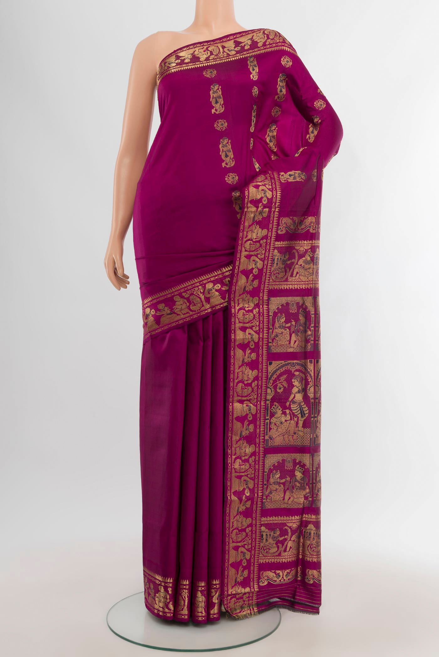 Magenta Baluchari Silk Saree with Zari And Thread Butta on the body and Zari Border.  displayed on a mannequin