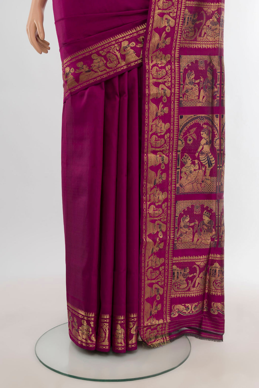 Pleats and pallu of Magenta Baluchari Silk Saree with Zari And Thread Butta on the body and Zari Border. 