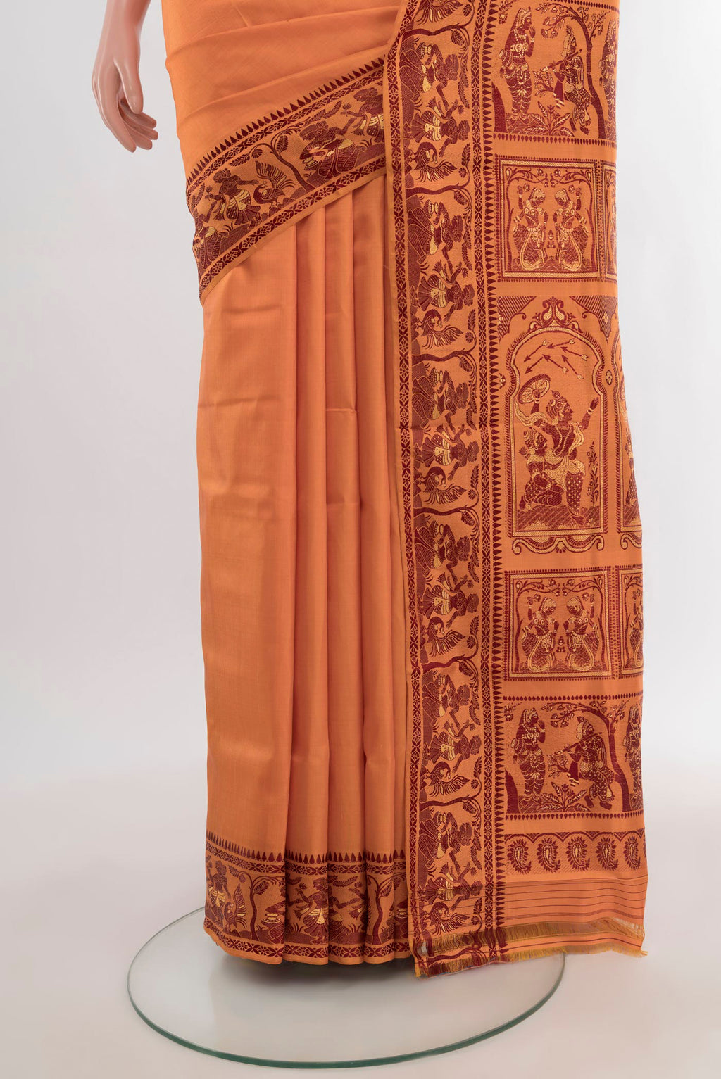 Pleats and pallu of Saffron Baluchari Silk Saree with Thread Butta on the body and Thread Border. 
