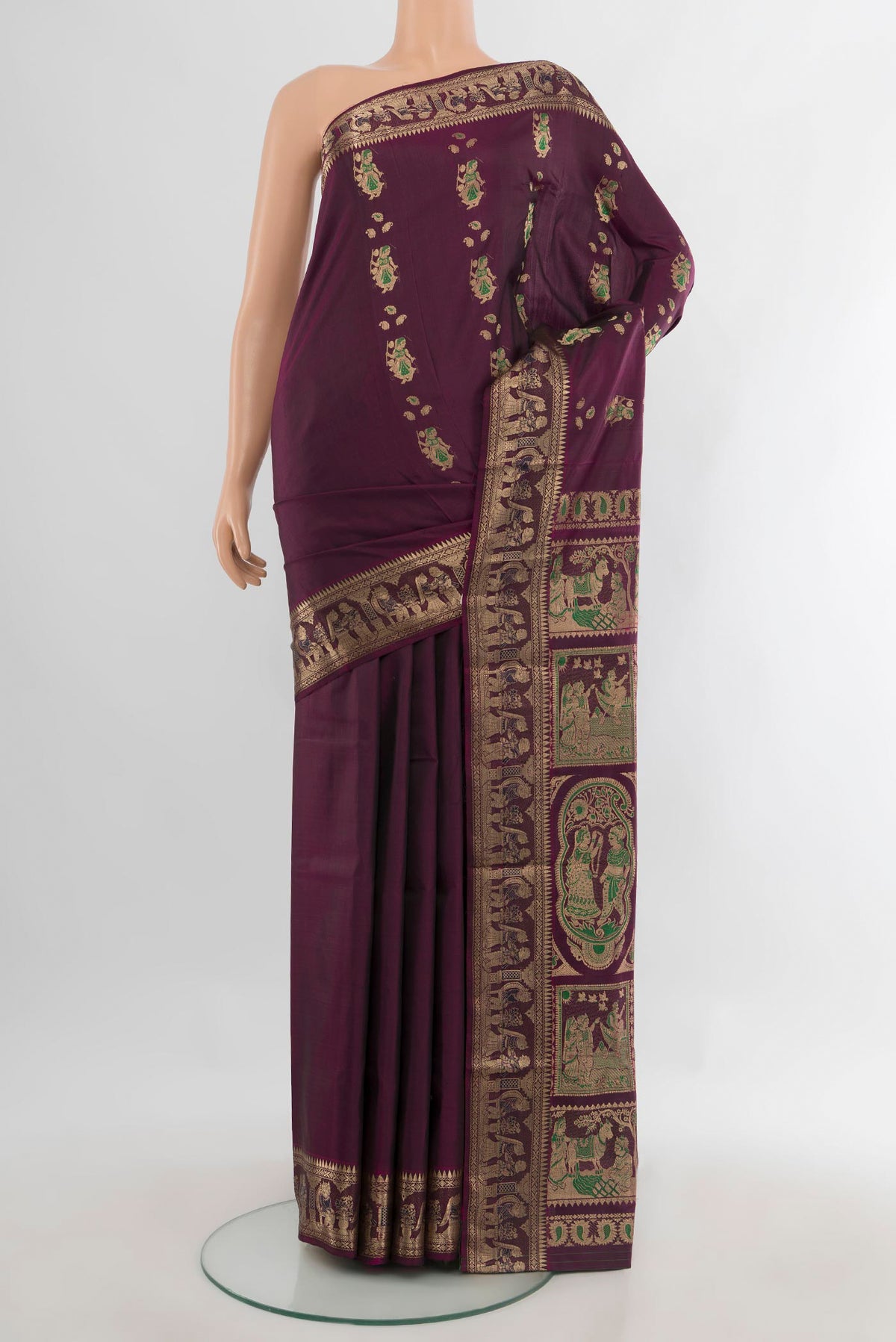 Pure Silk Purple Baluchari Saree with Zari And Thread Butta on the body and Zari Border.  displayed on a mannequin