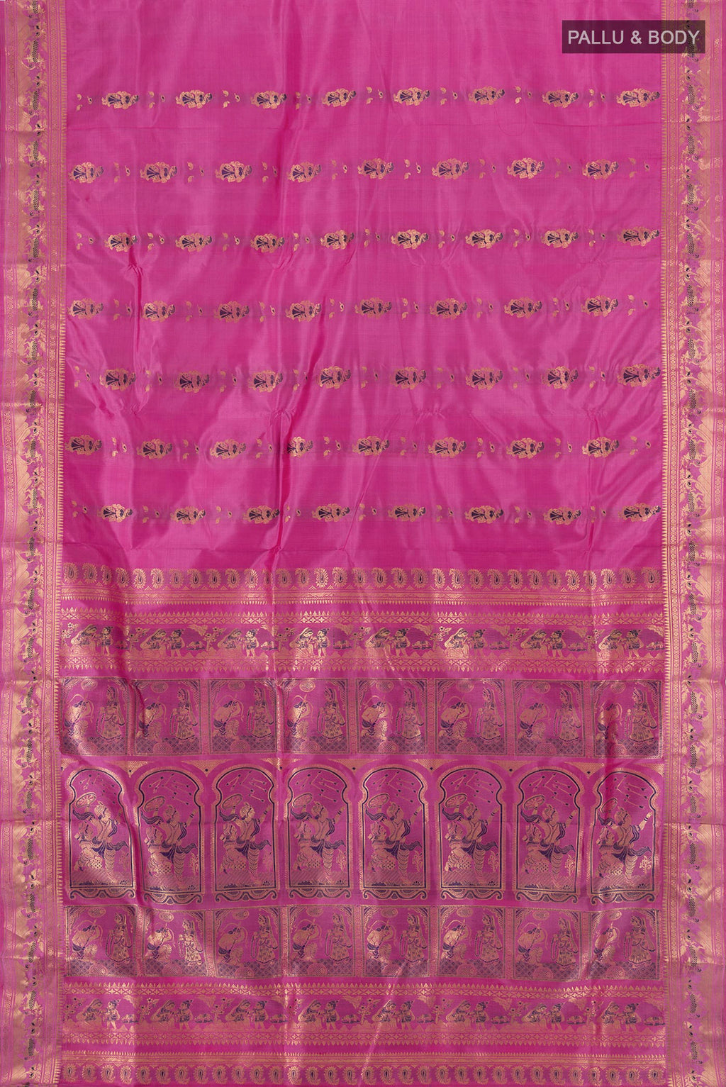 Flat view of Light Magenta Baluchari Silk Saree with Zari And Thread Butta on the body and Zari Border. 