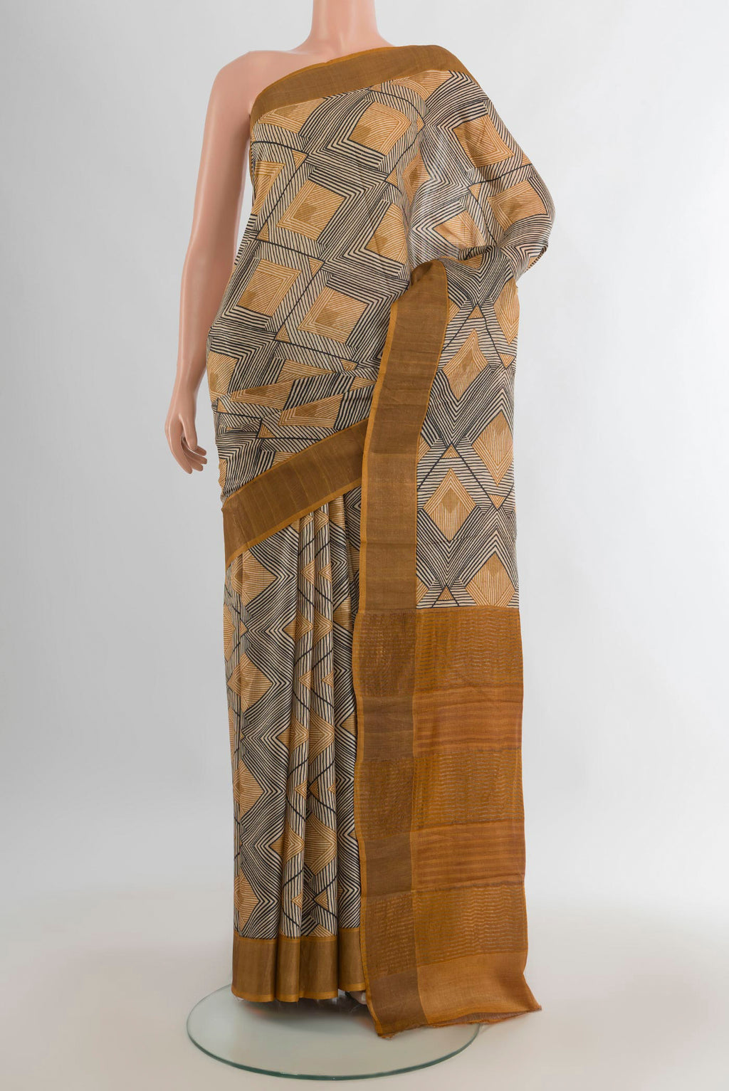 Multi Color Tussar Saree with Floral Print on the body and Zari Border.  displayed on a mannequin
