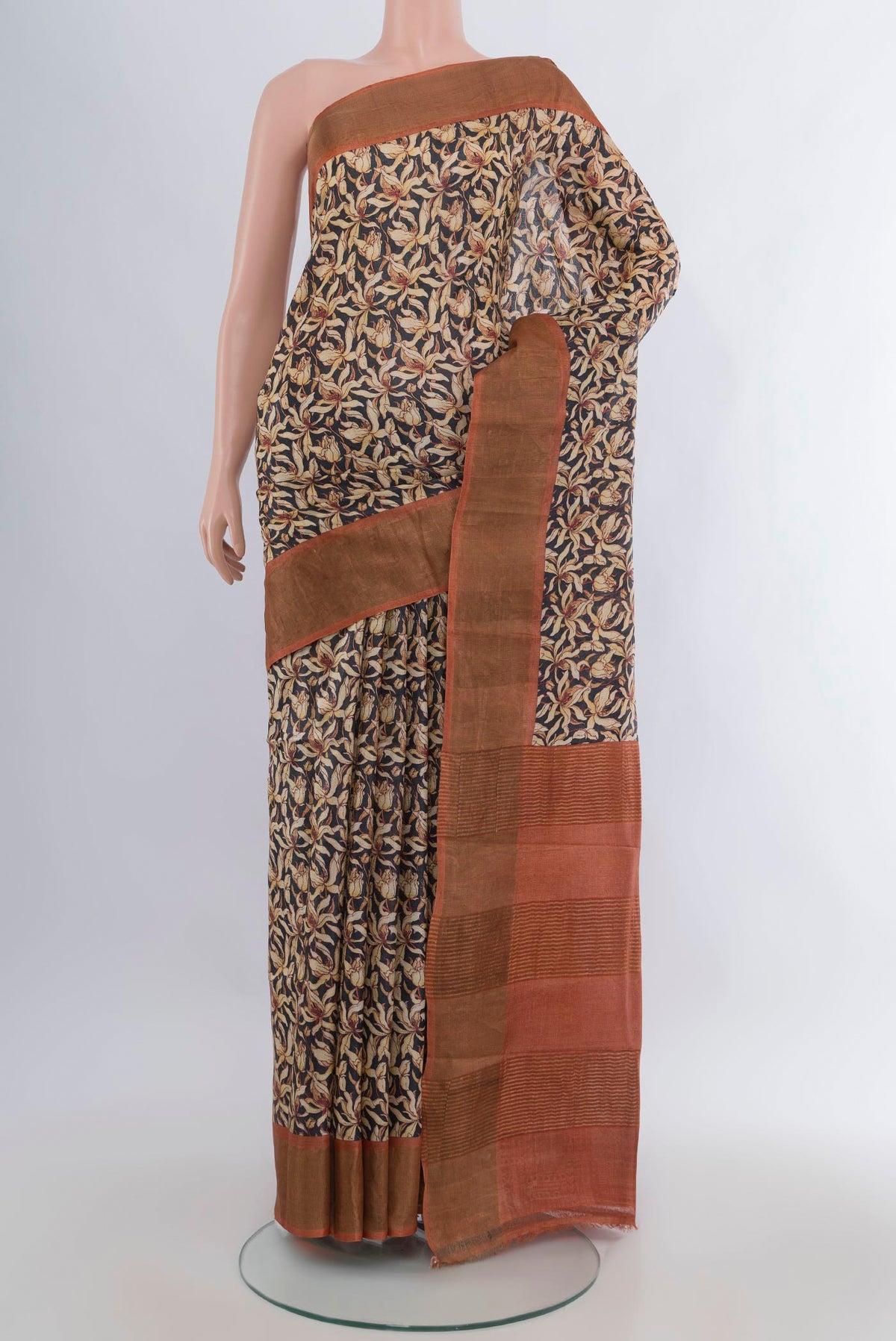 Multi Color Tussar Saree with Floral Print on the body and Zari Border.  displayed on a mannequin