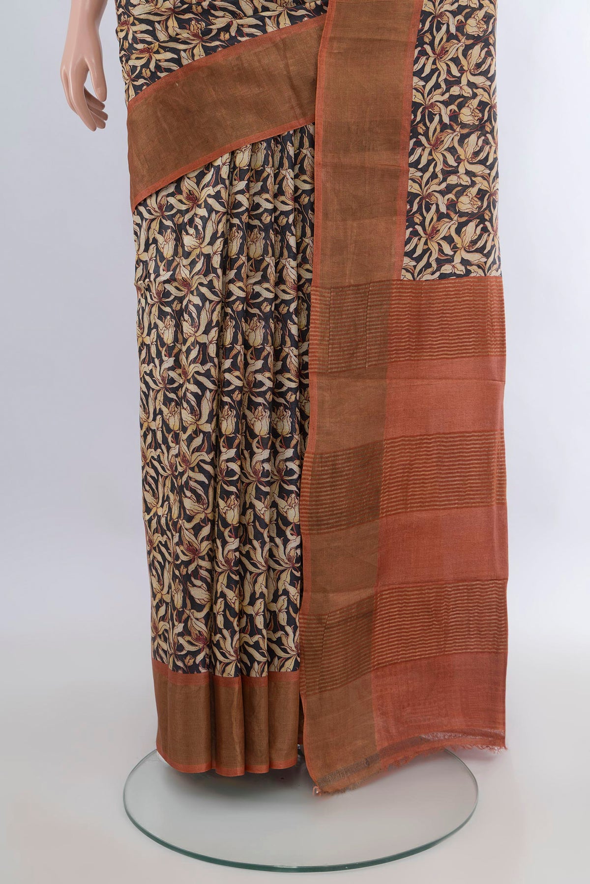 Pleats and pallu of Multi Color Tussar Saree with Floral Print on the body and Zari Border. 