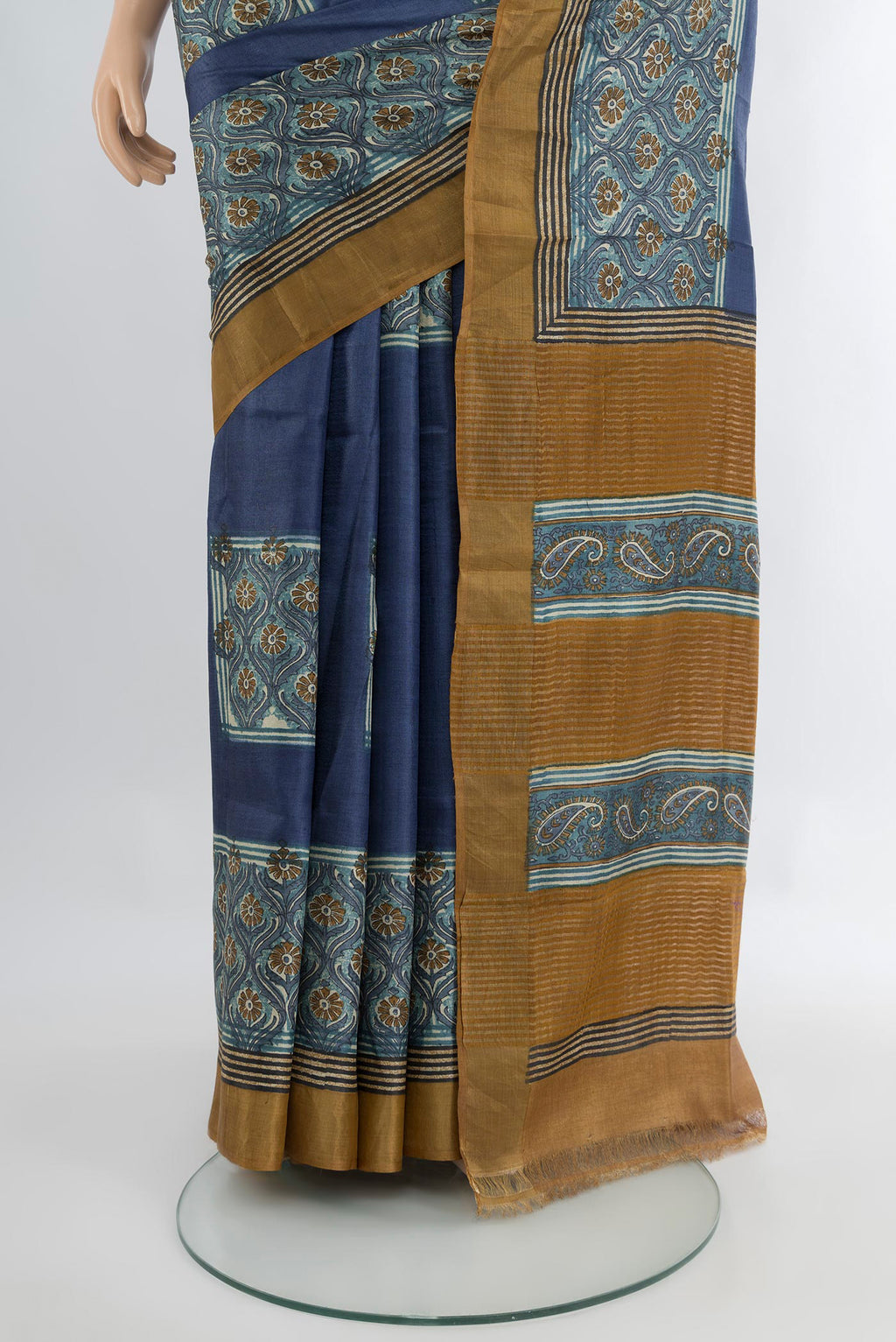Pleats and pallu of Blue Grey Tussar Silk Saree with Floral Print on the body and Zari Border. 