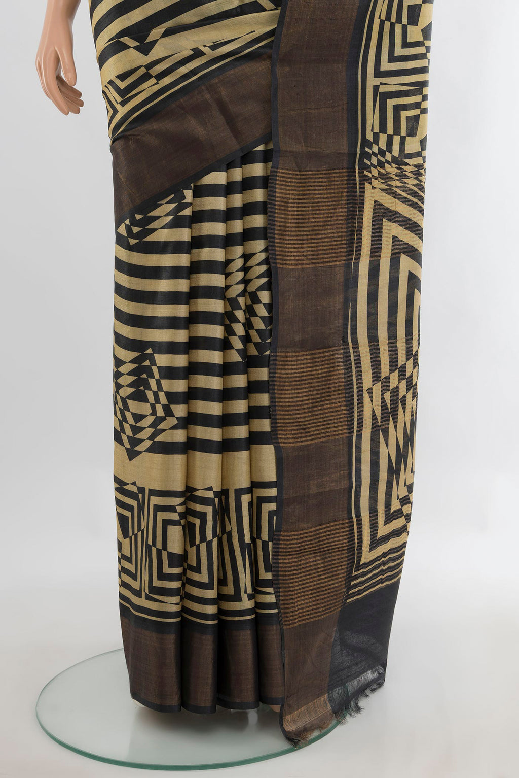 Pleats and pallu of Sandal Tussar Saree with Printed design on the body and Zari Border. 