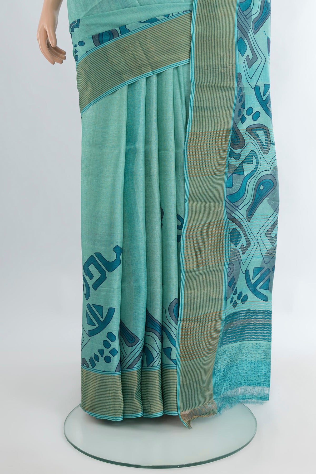 Pleats and pallu of Light Blue Tussar Silk Saree with Floral Print on the body and Zari Border. 