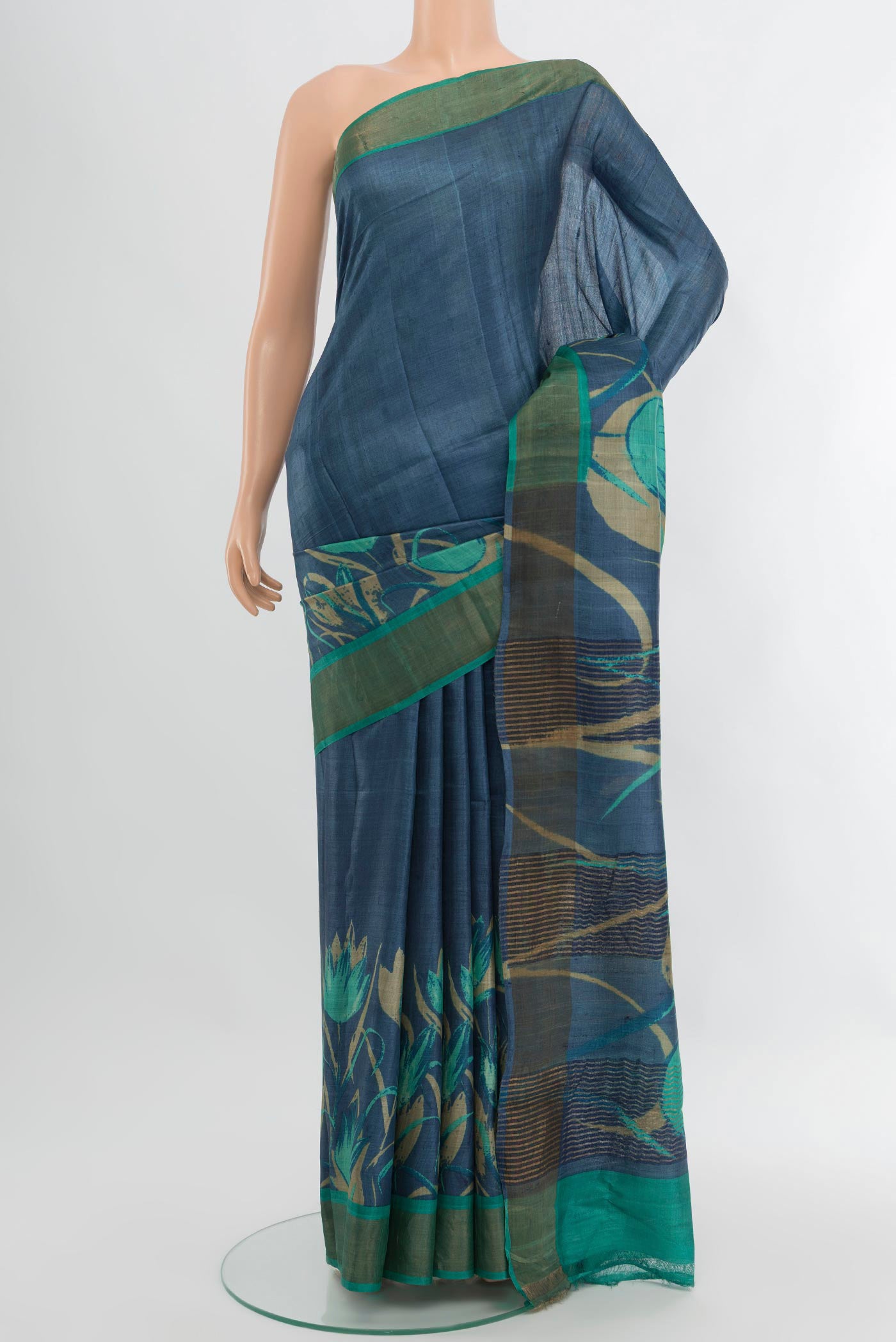 Blue Tussar Silk Saree with Plain Body and Zari Border.  displayed on a mannequin