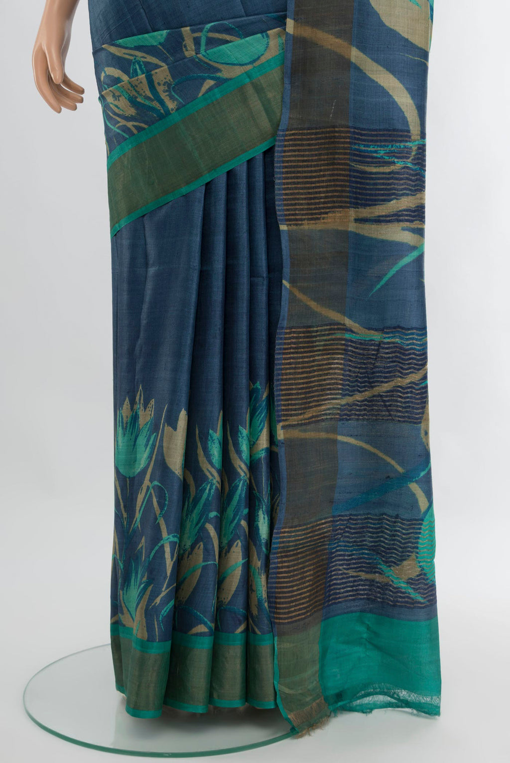 Pleats and pallu of Blue Tussar Silk Saree with Plain Body and Zari Border. 