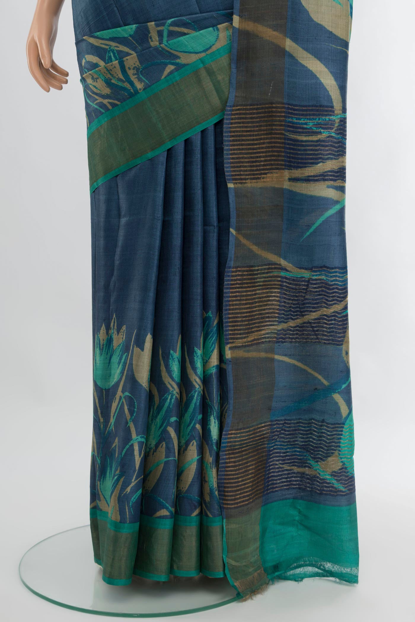 Pleats and pallu of Blue Tussar Silk Saree with Plain Body and Zari Border. 