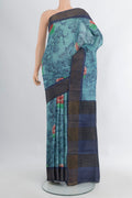Light Blue Tussar Silk Saree with Floral Print on the body and Zari Border.  displayed on a mannequin