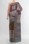 Multi Color Tussar Silk Saree with Floral Print on the body and Zari Border.  displayed on a mannequin
