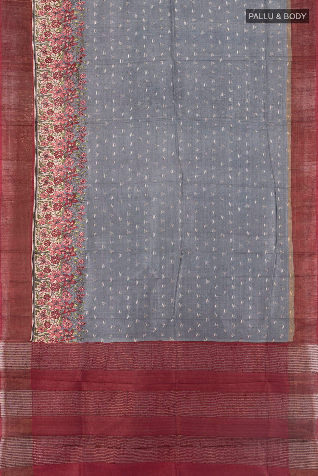 Flat view of Grey Tussar Silk Saree with Printed design on the body and Zari Border. 