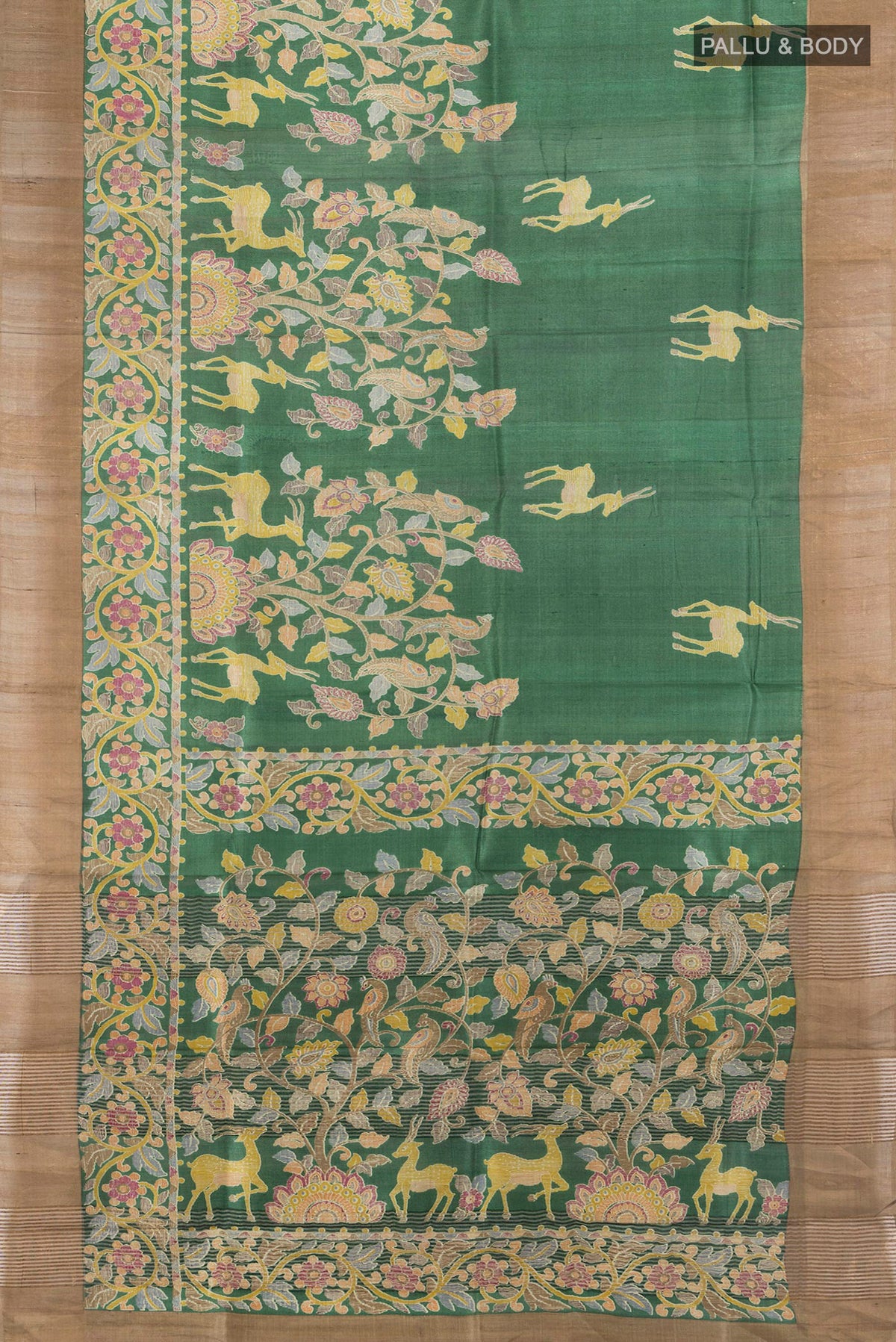 Flat view of Green Tussar Saree with Printed design on the body and Zari Border. 