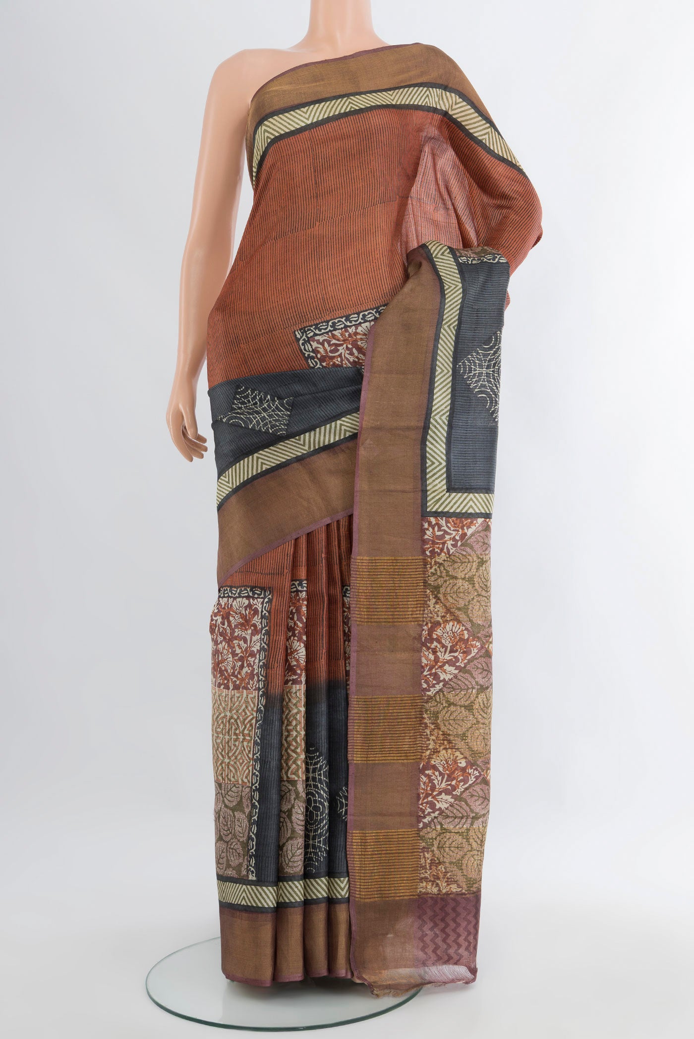 Multi Color Tussar Silk Saree with Floral Print on the body and Zari Border.  displayed on a mannequin