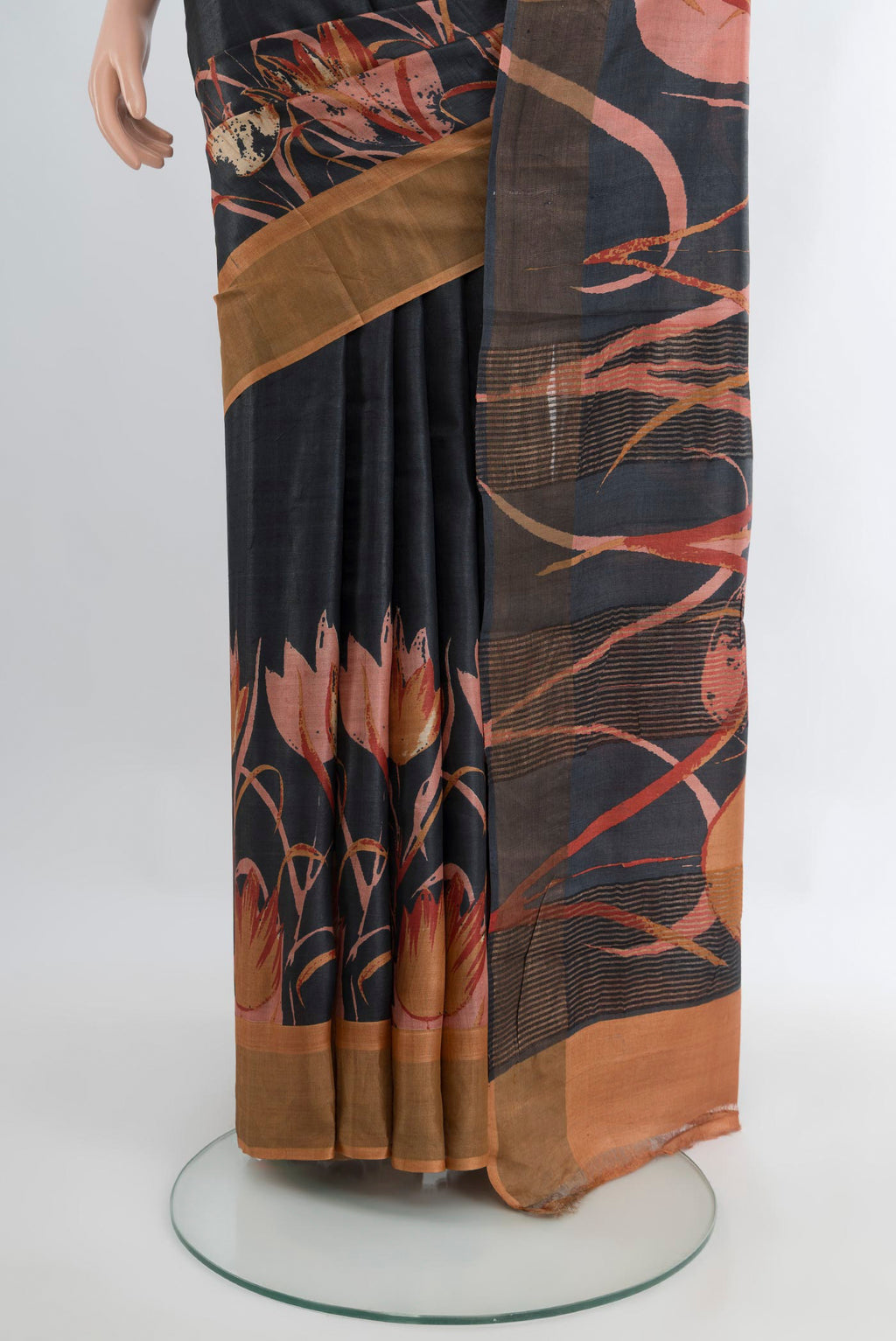 Pleats and pallu of Black Tussar Silk Saree with Plain Body and Fancy Border. 
