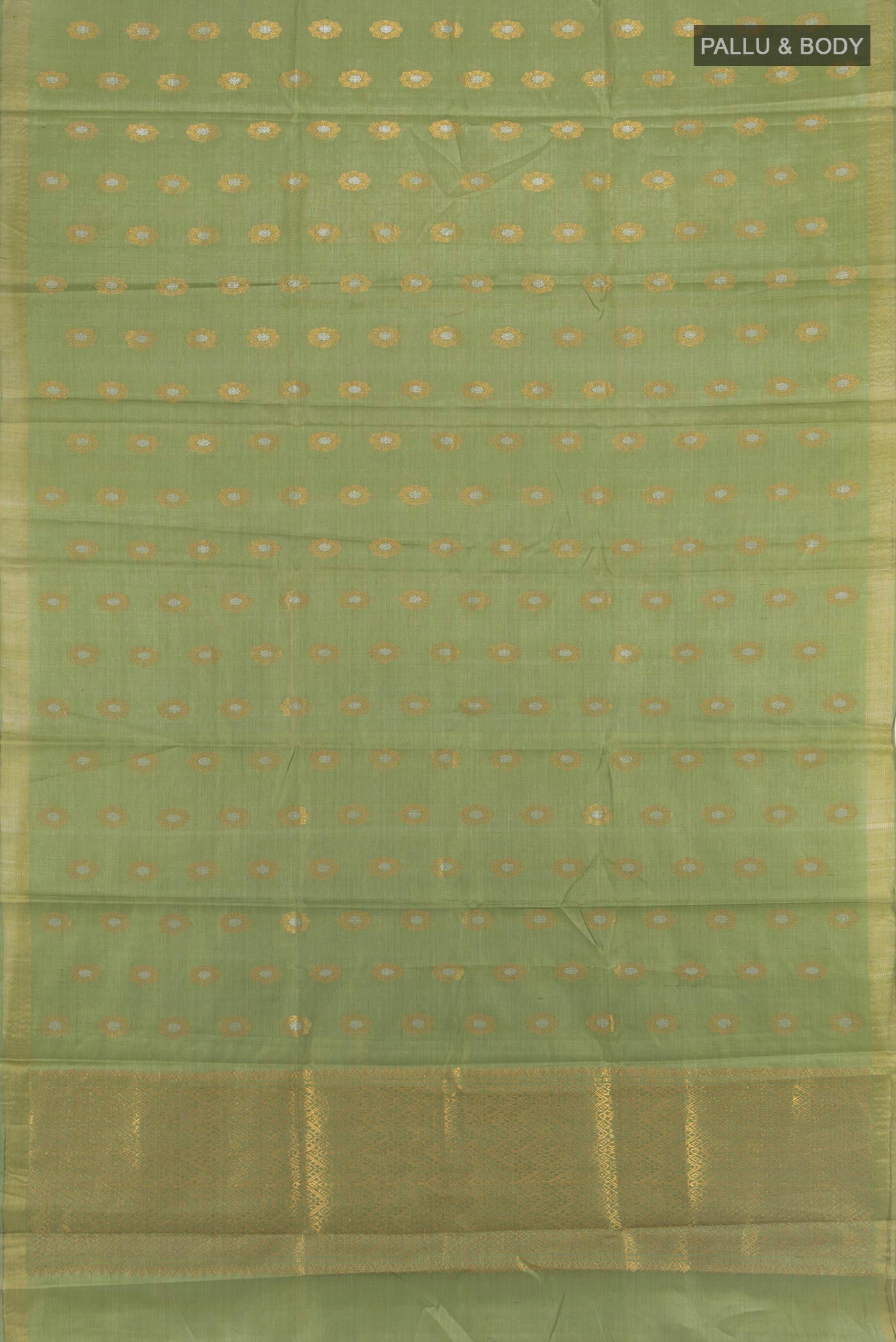 Flat view of Pista Green Tussar Silk Saree with Zari Butta on the body and Zari Border. 