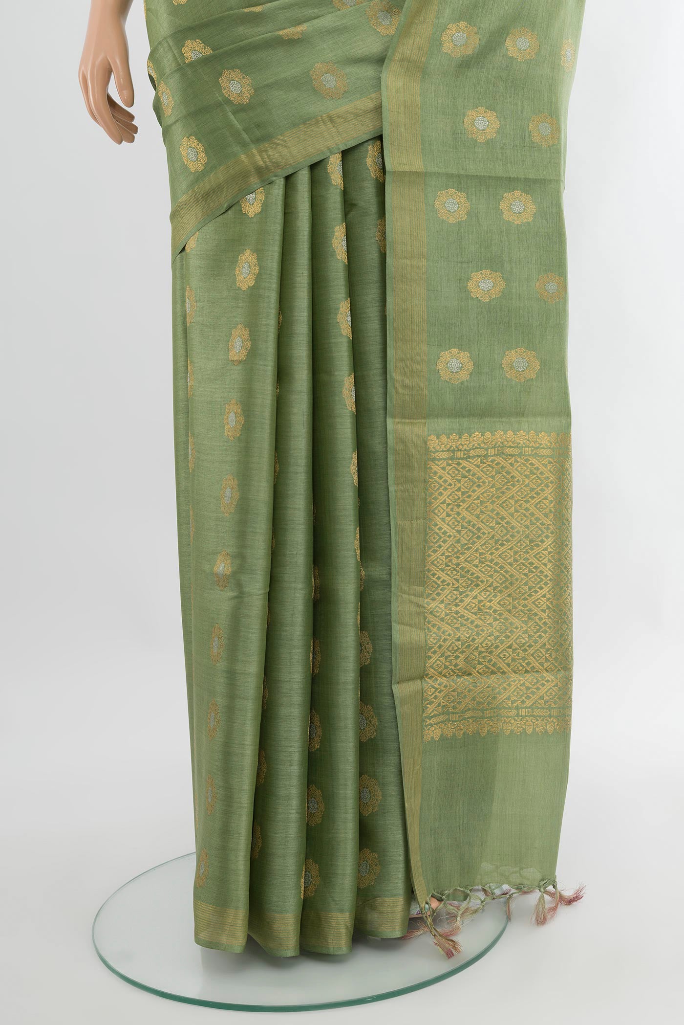 Pleats and pallu of Pista Green Tussar Silk Saree with Zari Butta on the body and Zari Border. 