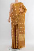 Golden Tussar Silk Saree with Zari Butta on the body and Without Border.  displayed on a mannequin
