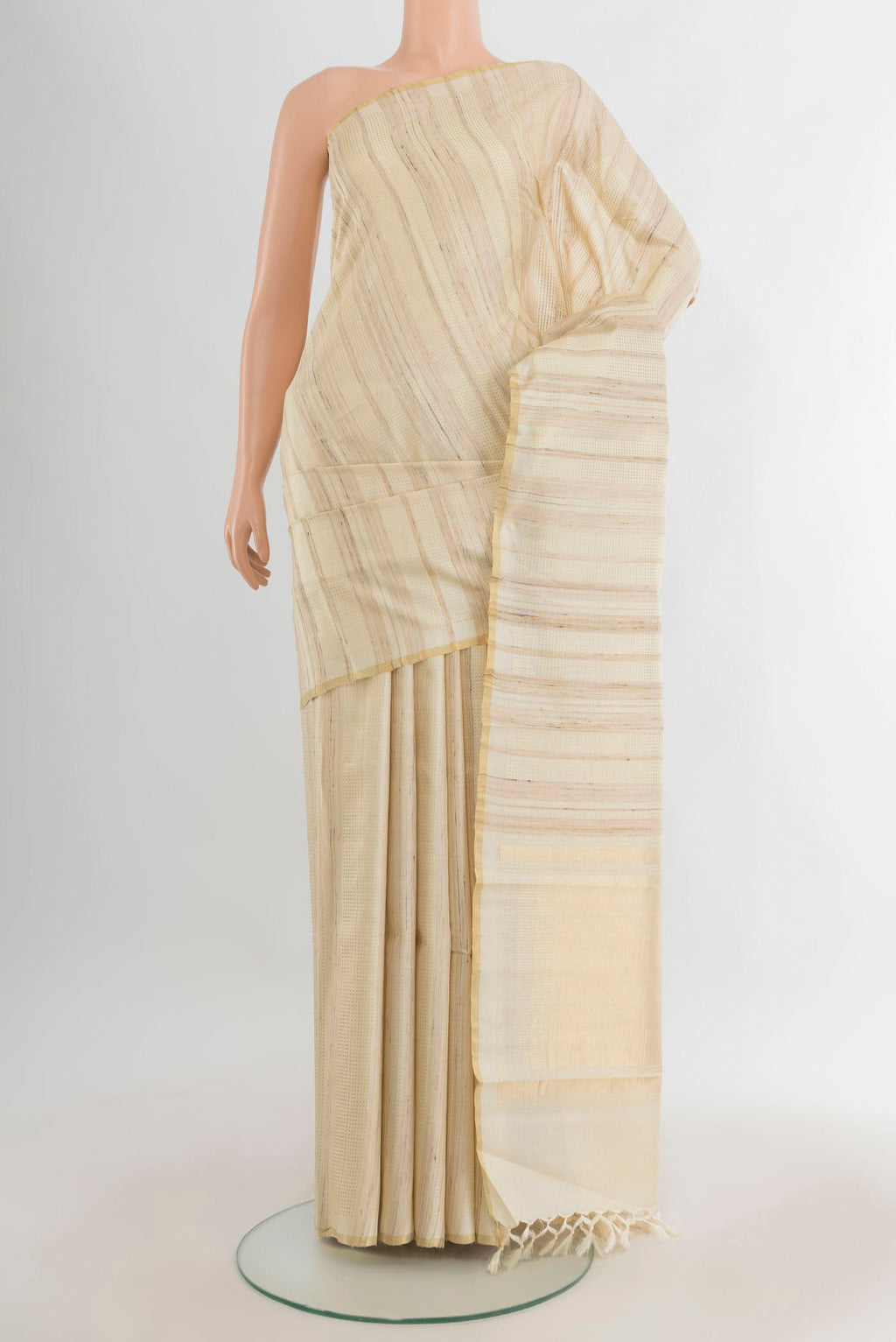 Cream Tussar Saree with Stripes on the body and Zari Border.  displayed on a mannequin