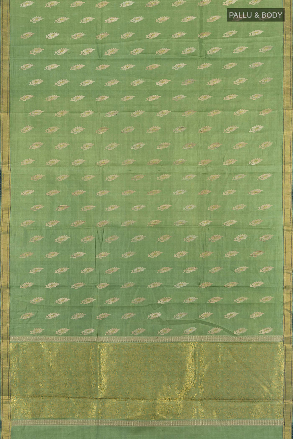Flat view of Light Green Tussar Silk Saree with Zari Butta on the body and Zari Border. 