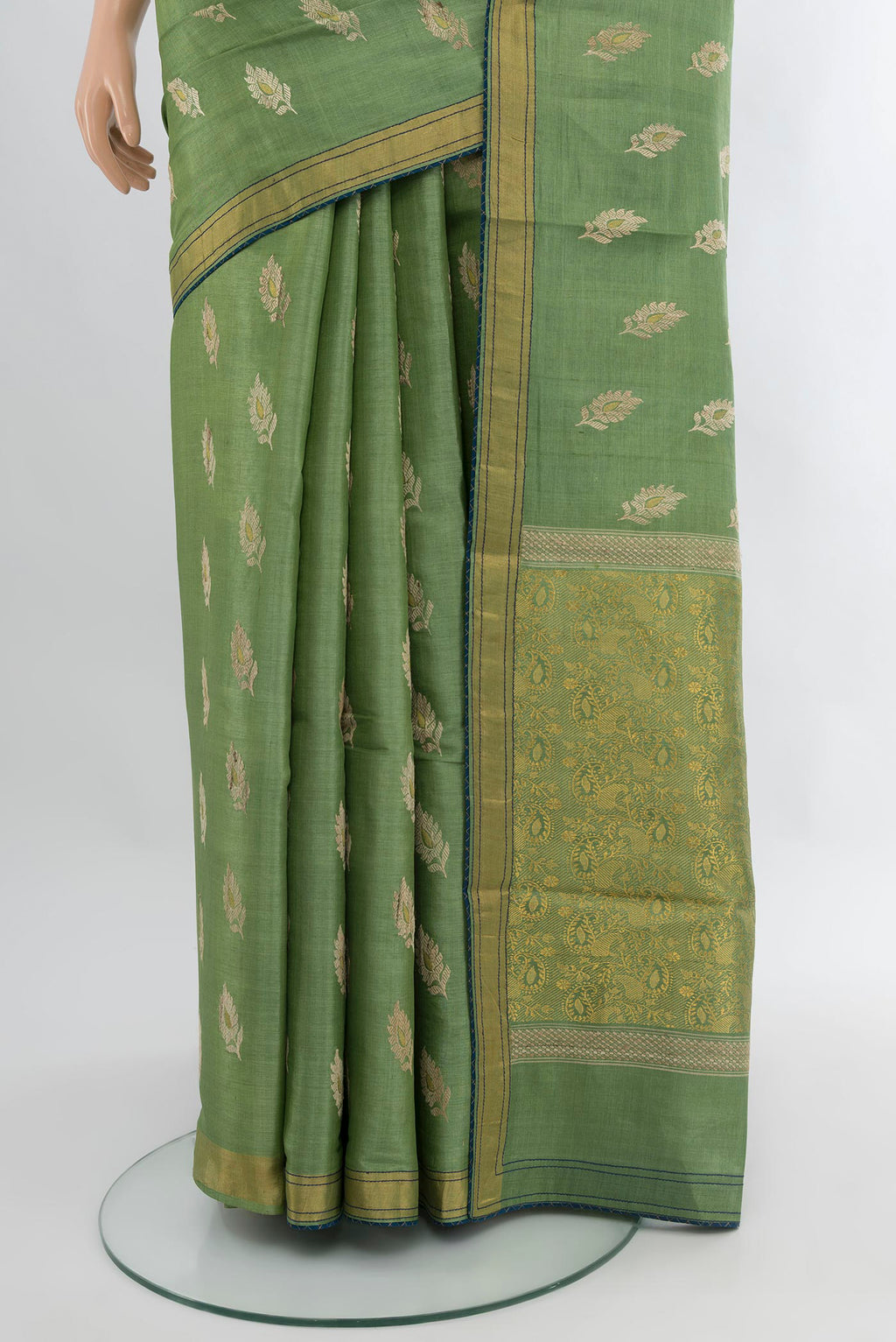 Pleats and pallu of Light Green Tussar Silk Saree with Zari Butta on the body and Zari Border. 