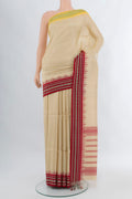 Cream Tussar Silk Saree with Plain Body and Thread Border.  displayed on a mannequin