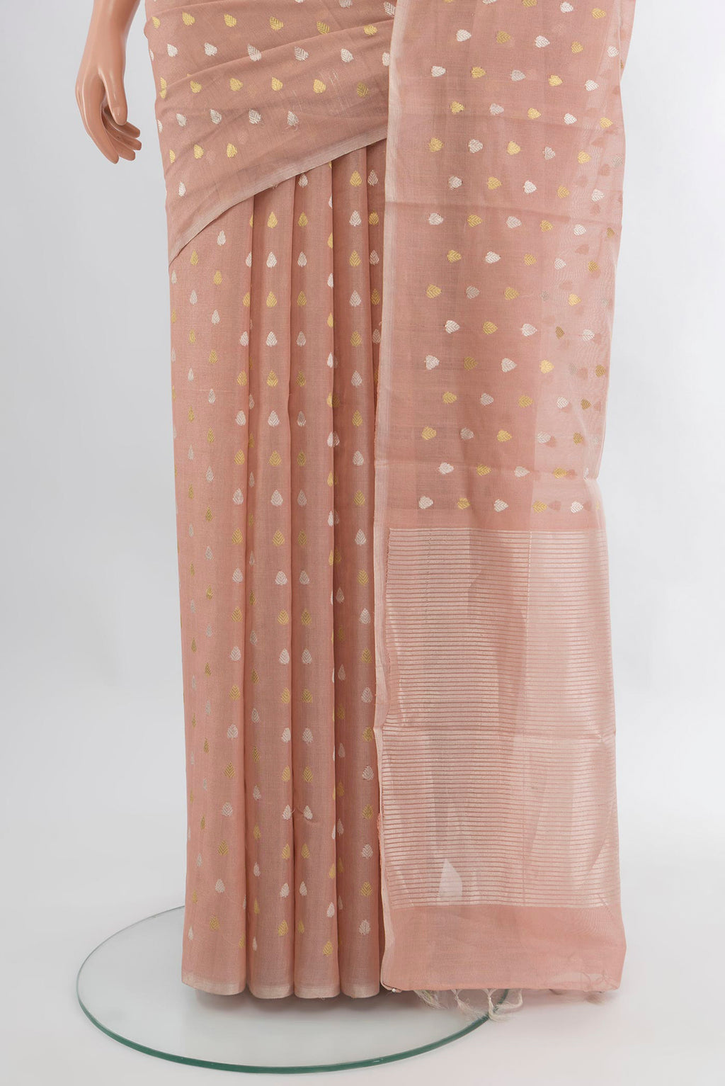 Pleats and pallu of Rose Gold Tussar Silk Saree with Zari Butta on the body and Zari Border. 