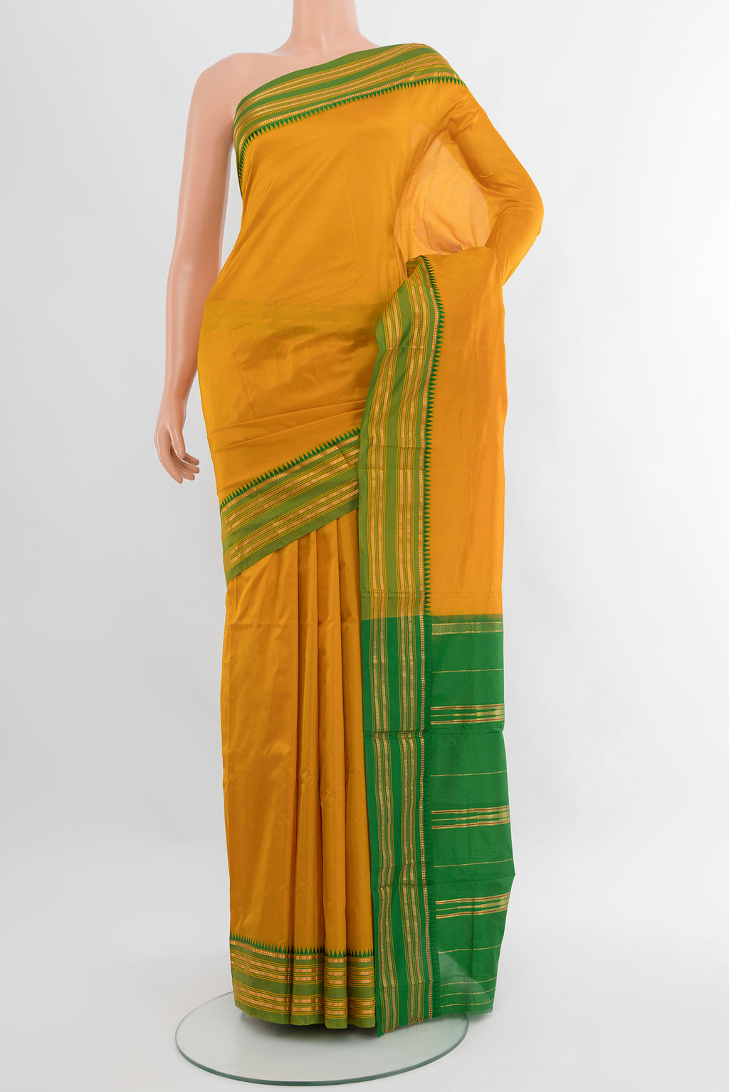 Mustard Narayanpet Silk Saree with Plain Body and Zari Border.  displayed on a mannequin