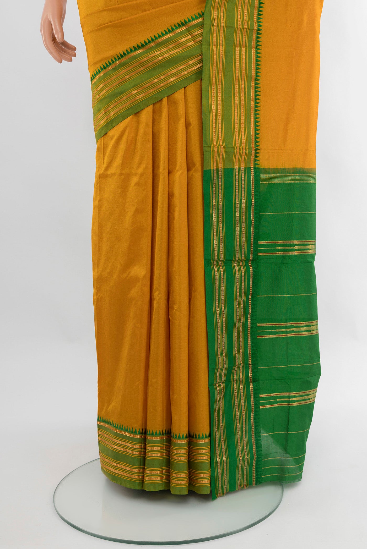 Pleats and pallu of Mustard Narayanpet Silk Saree with Plain Body and Zari Border. 
