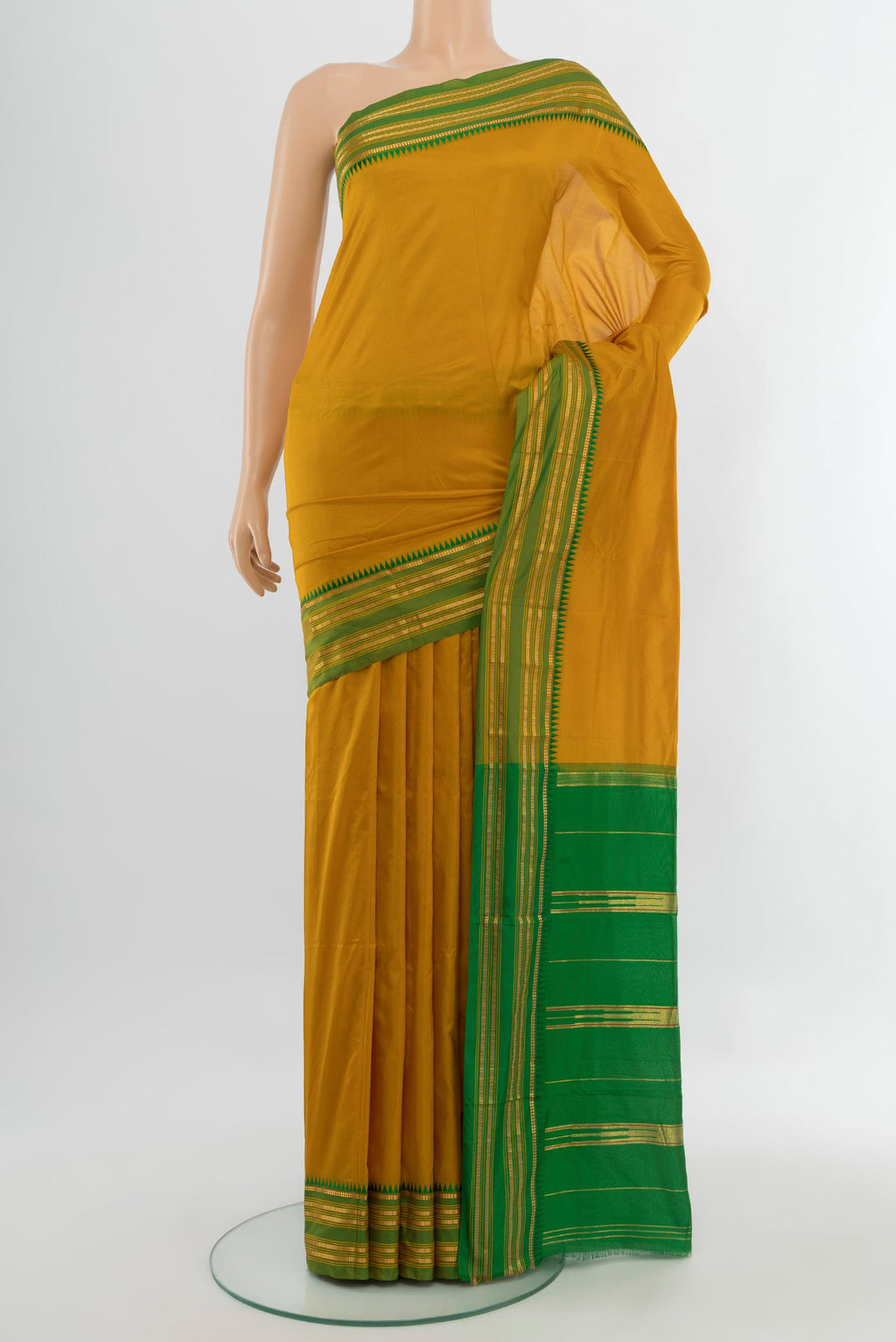 Mustard Narayanpet Silk Saree with Plain Body and Silk Border.  displayed on a mannequin