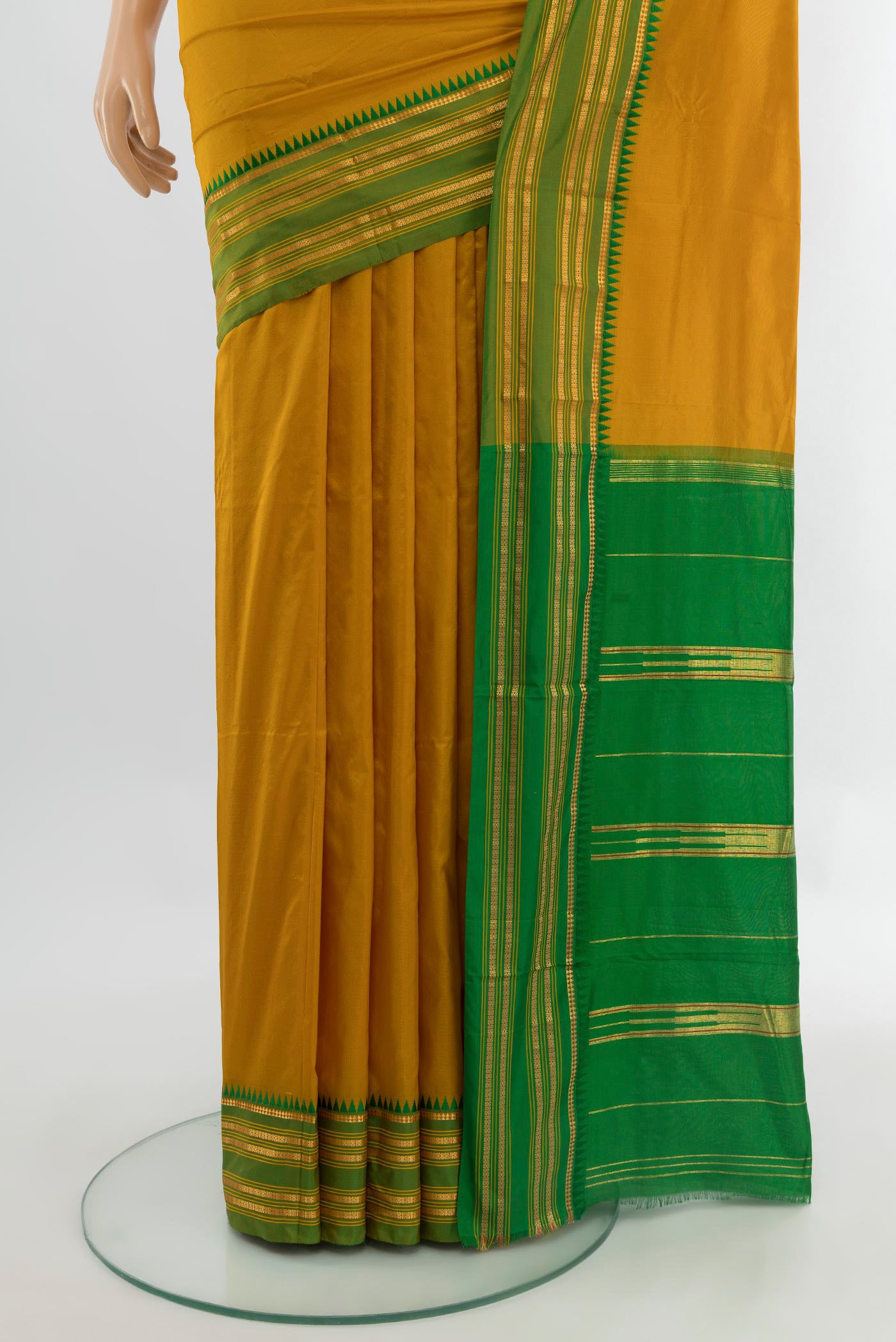 Pleats and pallu of Mustard Narayanpet Silk Saree with Plain Body and Silk Border. 