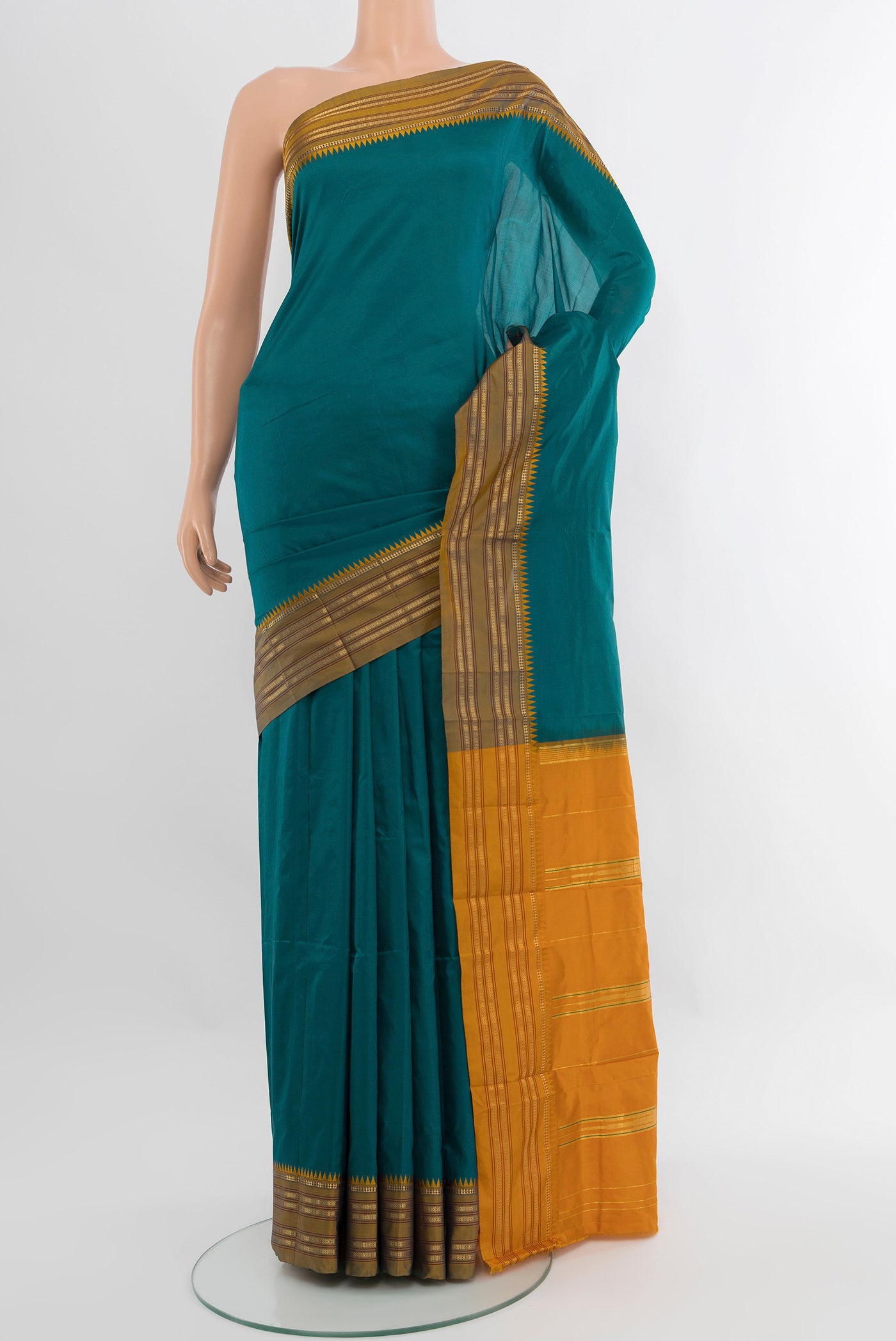 Peacock Blue Narayanpet Silk Saree with Plain Body and Zari Border.  displayed on a mannequin
