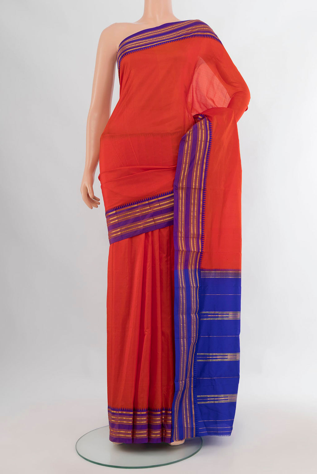 Pure Silk Brick Orange Narayanpet Saree with Plain Body and Zari Border.  displayed on a mannequin