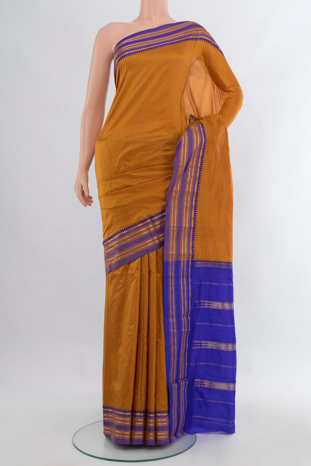 Mustard Narayanpet Silk Saree with Checked design on the body and Zari Border.  displayed on a mannequin