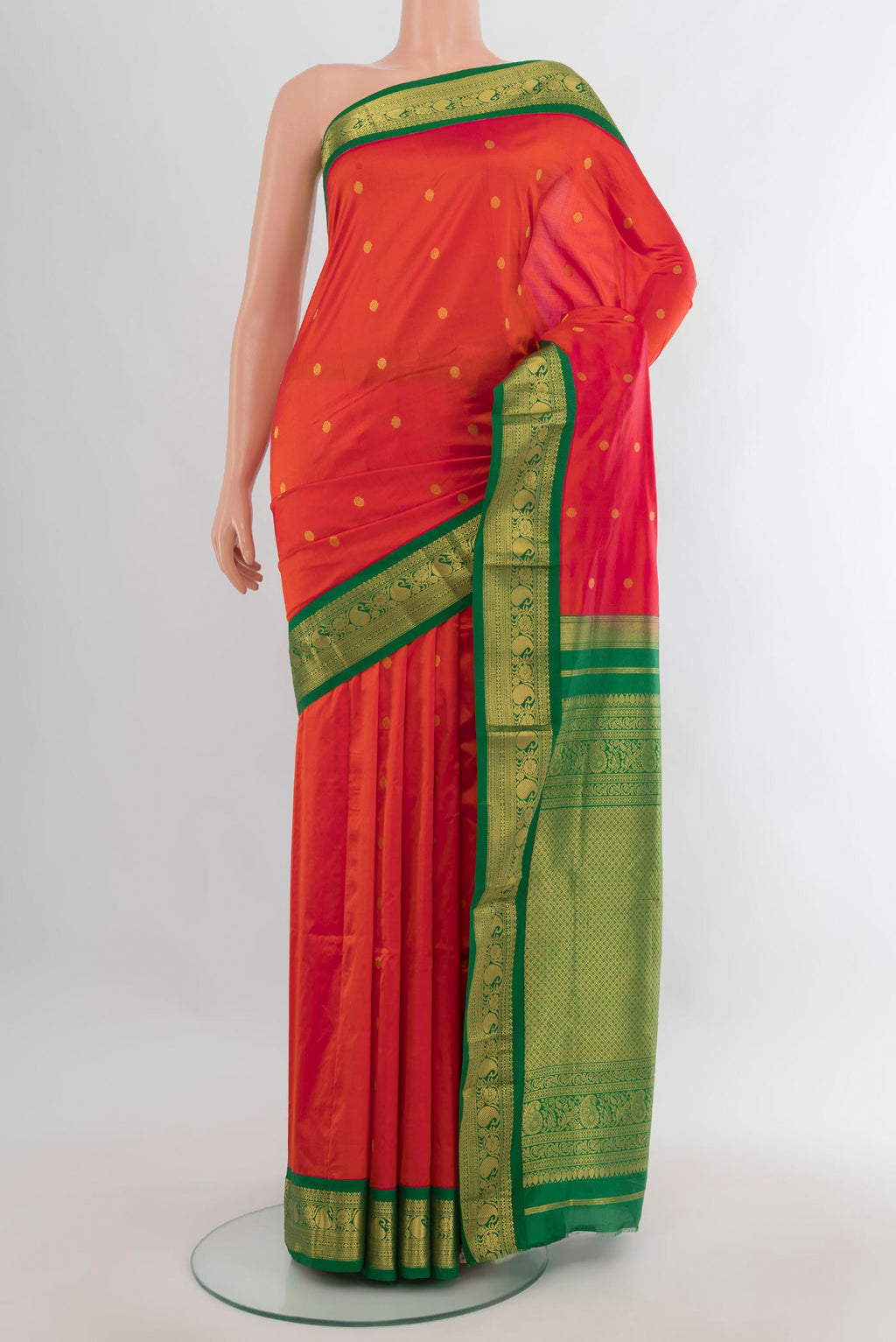 Pure Silk Orange Bangalore - kadyal Saree with Zari Butta on the body and Zari Border.  displayed on a mannequin