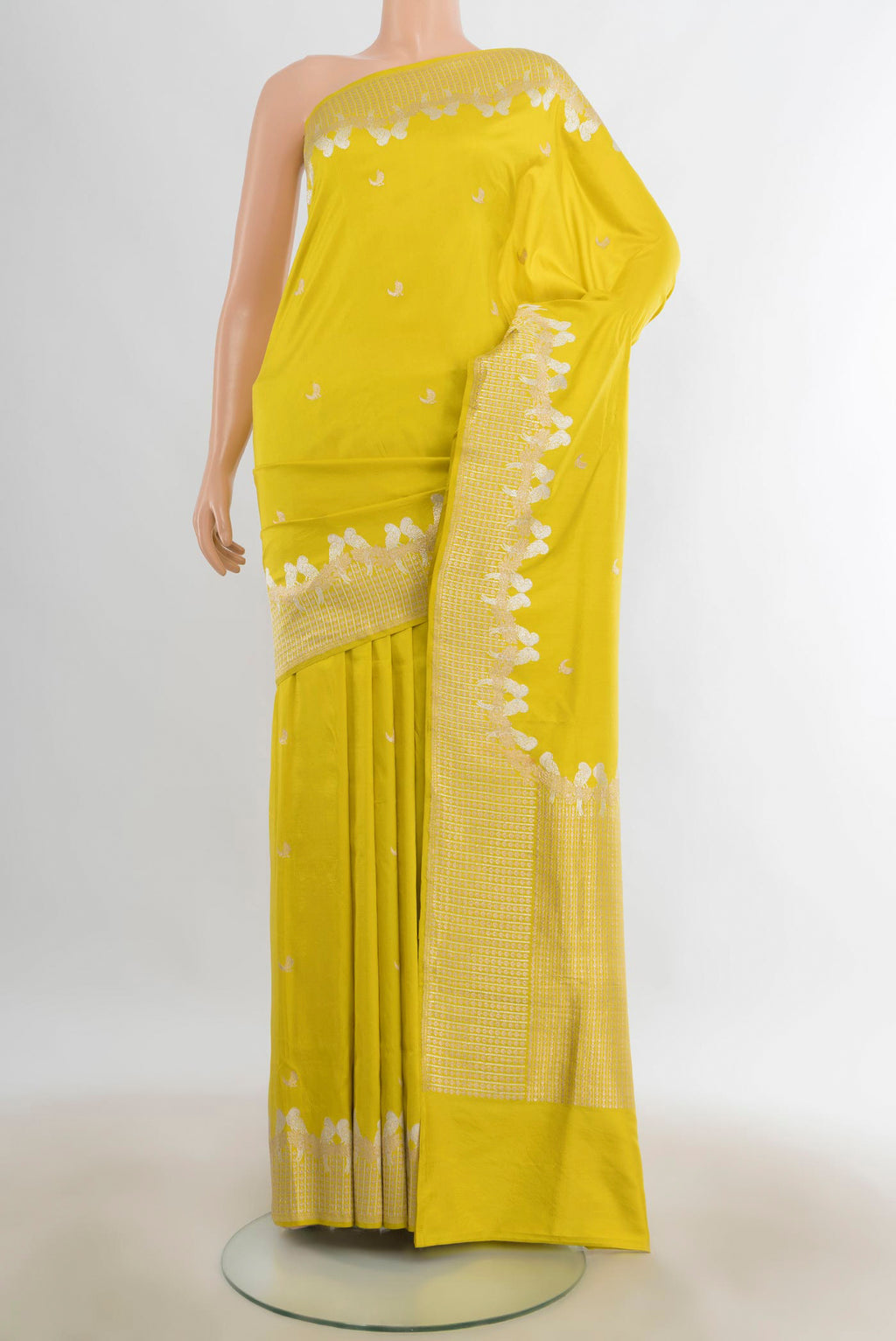 Pure Silk Lemon Yellow Banarasi Katan Saree with Zari Butta on the body and Zari Border.  displayed on a mannequin