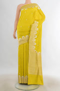 Pure Silk Lemon Yellow Banarasi Katan Saree with Zari Butta on the body and Zari Border.  displayed on a mannequin