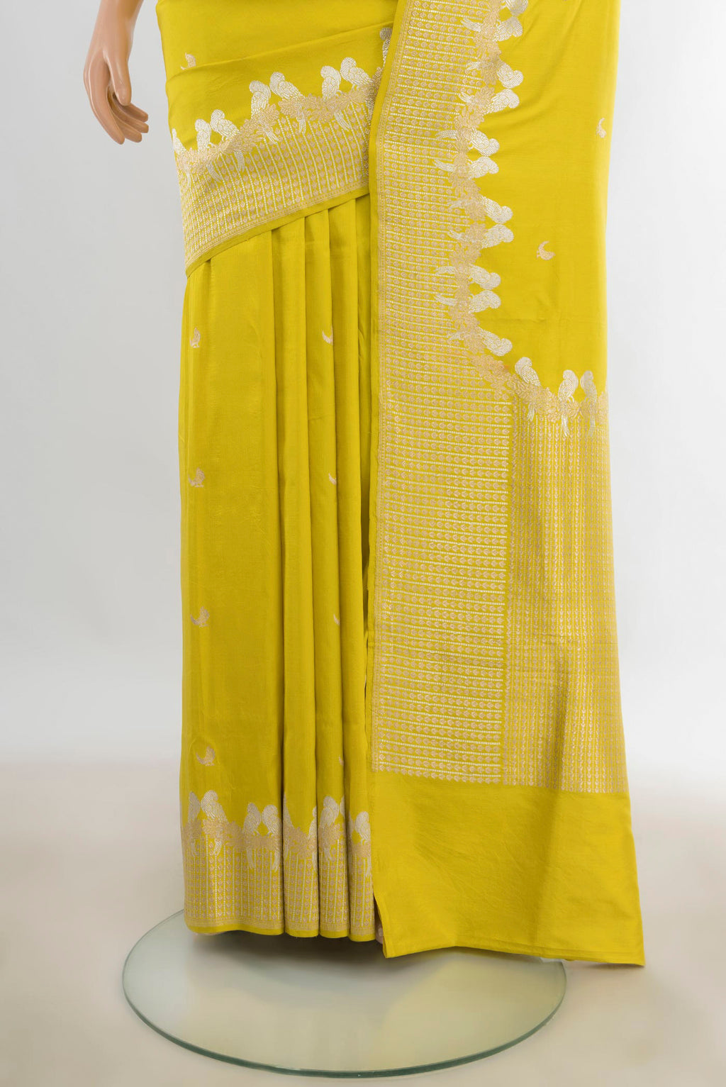 Pleats and pallu of Pure Silk Lemon Yellow Banarasi Katan Saree with Zari Butta on the body and Zari Border. 