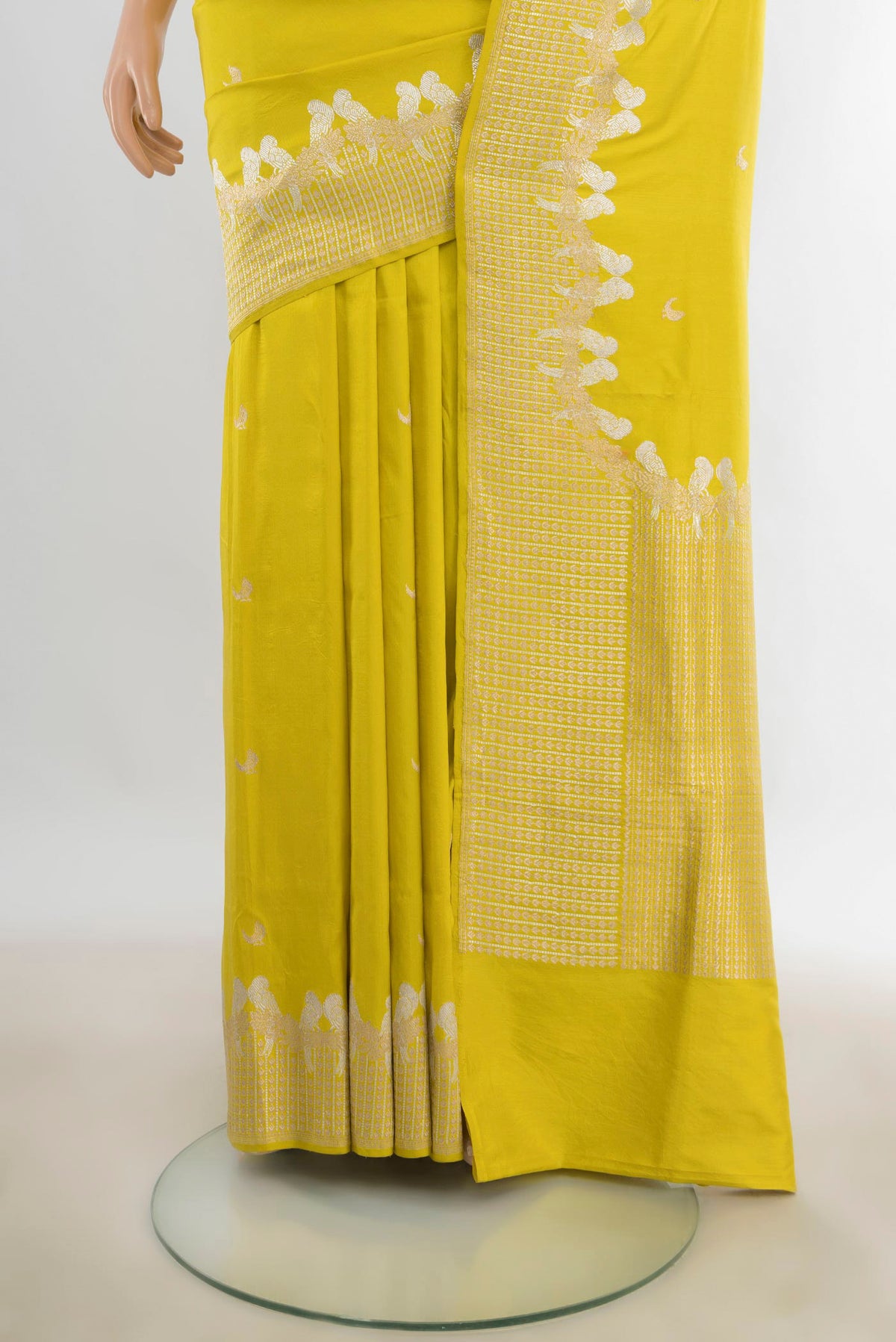 Pleats and pallu of Pure Silk Lemon Yellow Banarasi Katan Saree with Zari Butta on the body and Zari Border. 