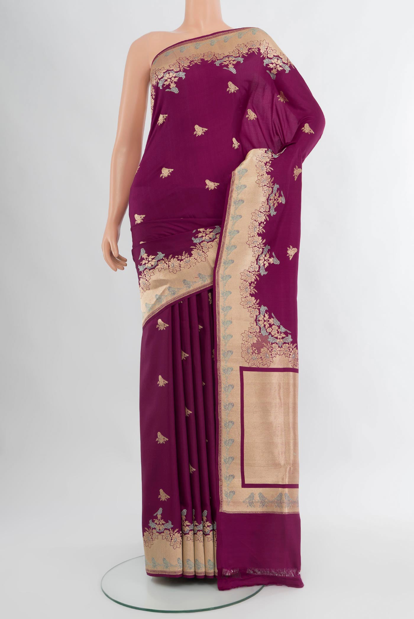 Magenta Banarasi Silk Saree with Zari Butta on the body and Fancy Border.  displayed on a mannequin