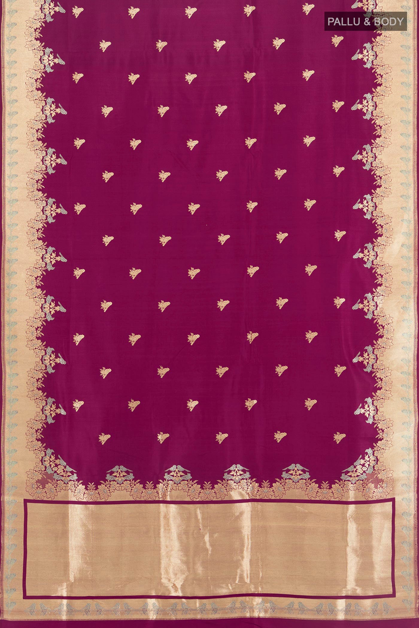 Flat view of Magenta Banarasi Silk Saree with Zari Butta on the body and Fancy Border. 