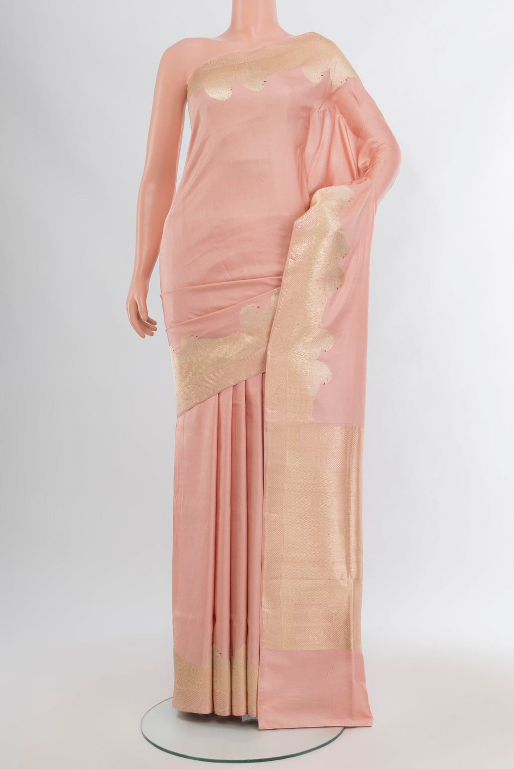 Rose Gold Banarasi Katan Silk Saree with Plain Body and Zari Border.  displayed on a mannequin