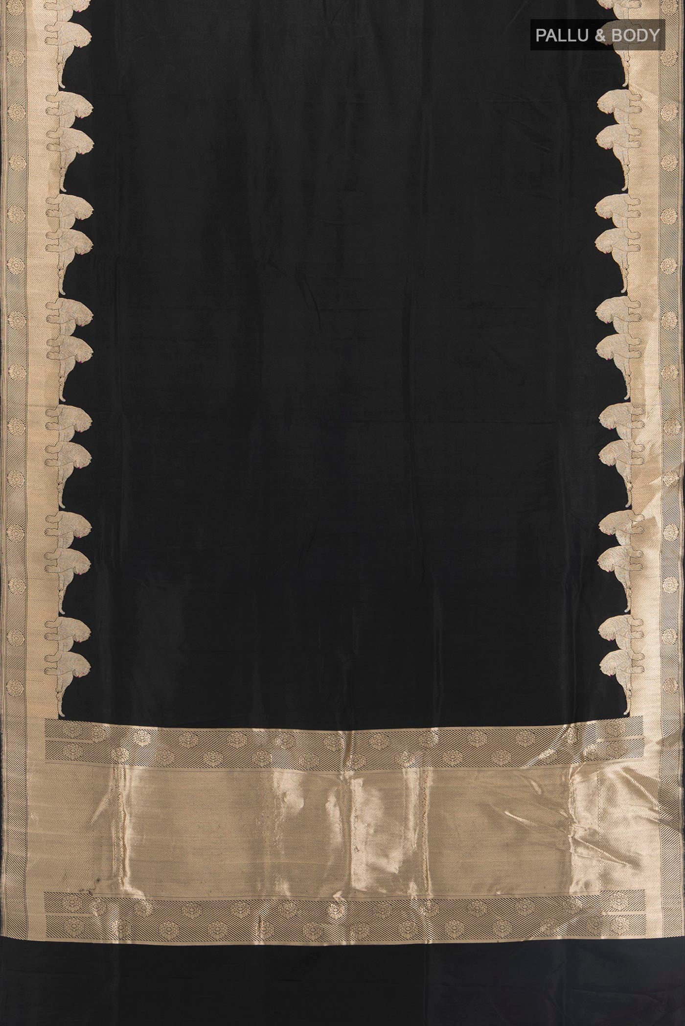 Flat view of Black Banarasi Silk Saree with Plain Body and Fancy Border. 