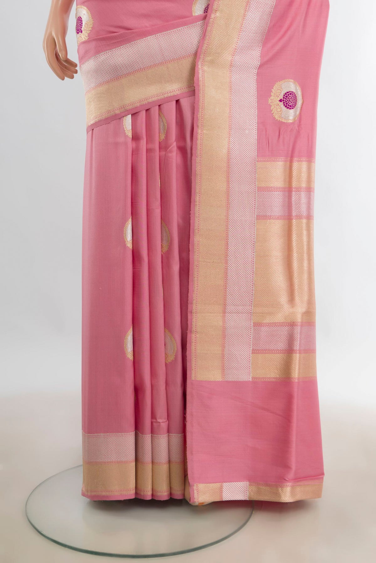 Pleats and pallu of Pure Silk Rose pink Banarasi Saree with Zari Butta on the body and Zari Border. 