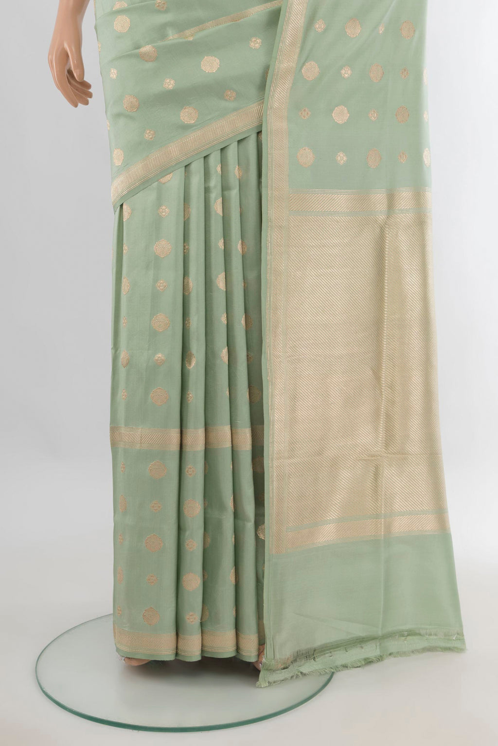 Pleats and pallu of Pure Silk Pista Green Banarasi Saree with Zari Butta on the body and Zari Border. 
