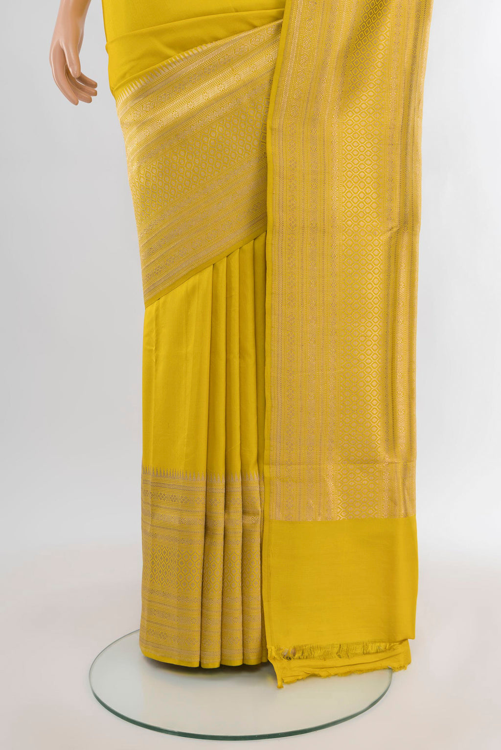 Pleats and pallu of Lemon Yellow Banarasi Silk Saree with Plain Body and Fancy Border. 