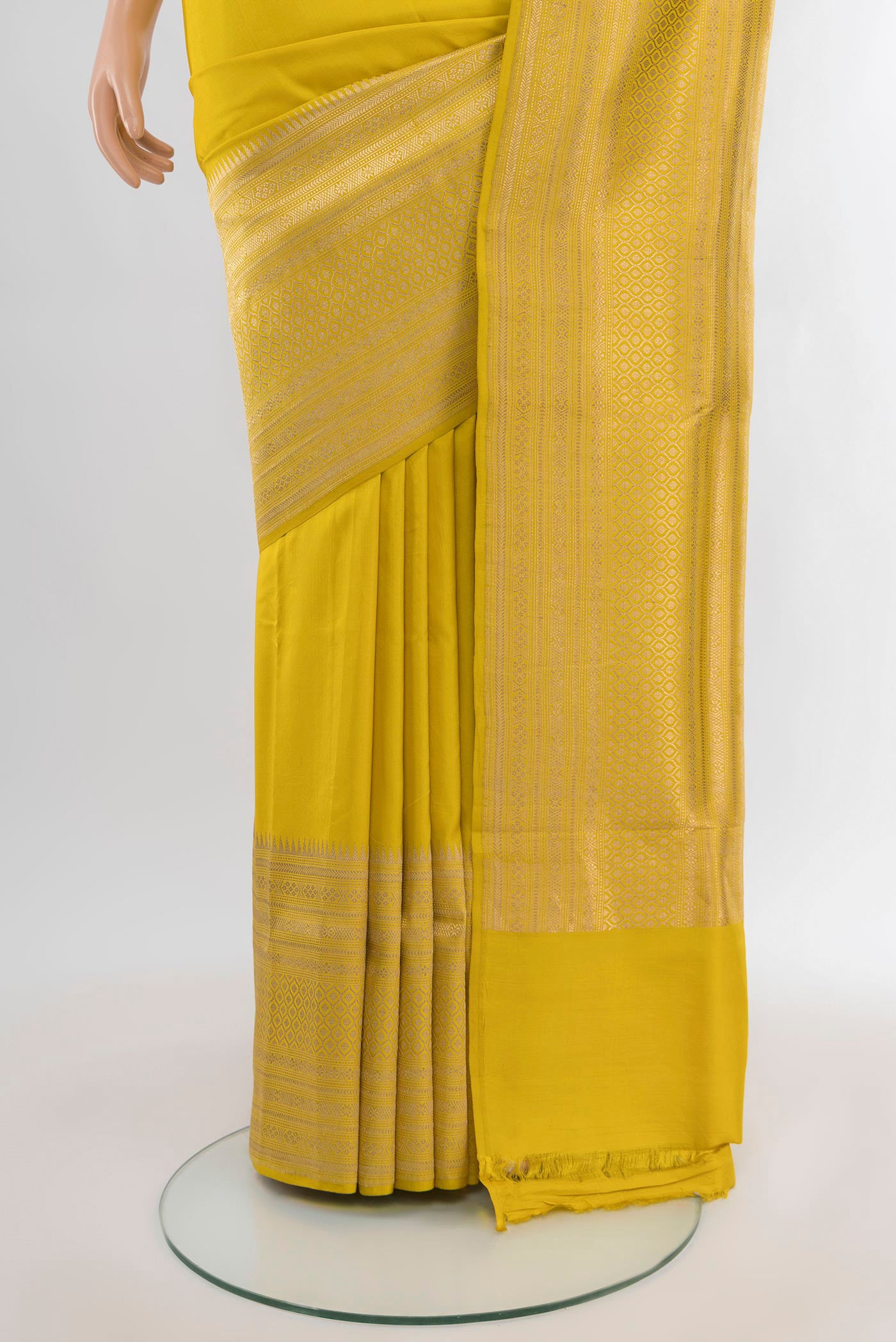 Pleats and pallu of Lemon Yellow Banarasi Silk Saree with Plain Body and Fancy Border. 