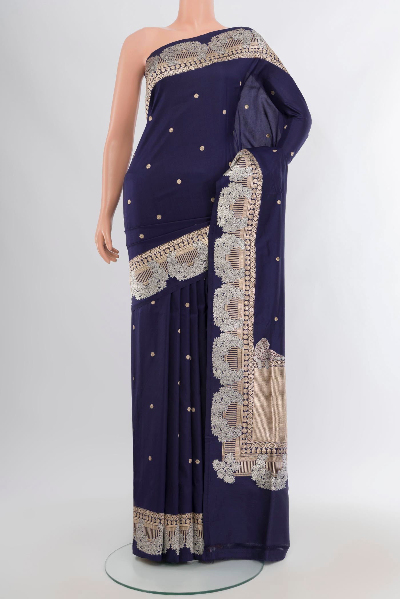 Navy Blue Banarasi Katan Silk Saree with Plain Body and Zari Border.  displayed on a mannequin